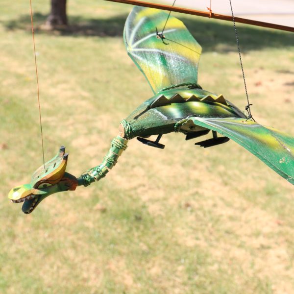 this beautiful dragon mobile has a wingspan and length of approximately 37cm x 30cm and hangs 40 cm down from its hook.Just hang this beautiful flying dragon indoors or out... preferably in your garden