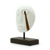 this unique piece combines traditional Timor craftsmanship with a contemporary white finish. This decorative mask appeals to customers seeking distinctive and culturally rich home décor items. Its striking design and neutral color make it a versatile addition to any interior style. Stock this captivating mask to attract customers and boost your product offerings