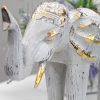stature and strength. These Wholesale Elephants have been lightly painted in white and turquoise colours and added a golden glitter to it. These beautiful Hand Carved Elephant will bring an old world feeling of Bali into any room. Hand carved in Indonesia from Albesia wood